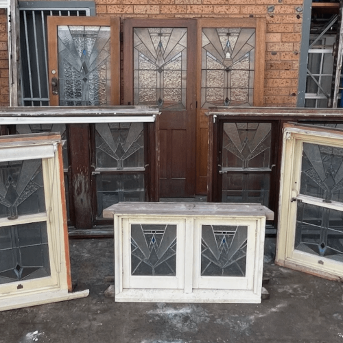 Collection of vintage doors and windows with Art Deco glass panels. Architectural salvage.